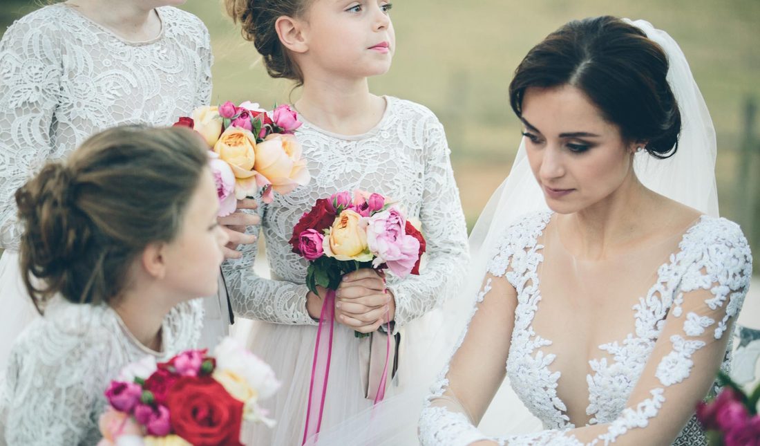 The bride with her bridesmaids and flower girls before the ceremony