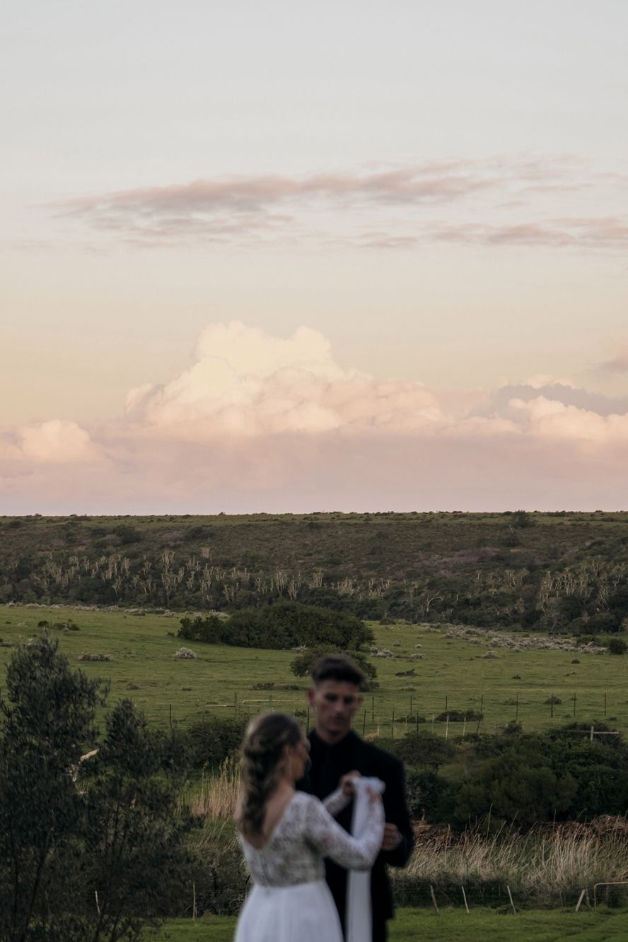 A couple in the open countryside beyond the estate