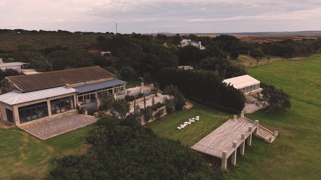 The estate from above, the barn, the lawns and the river deck